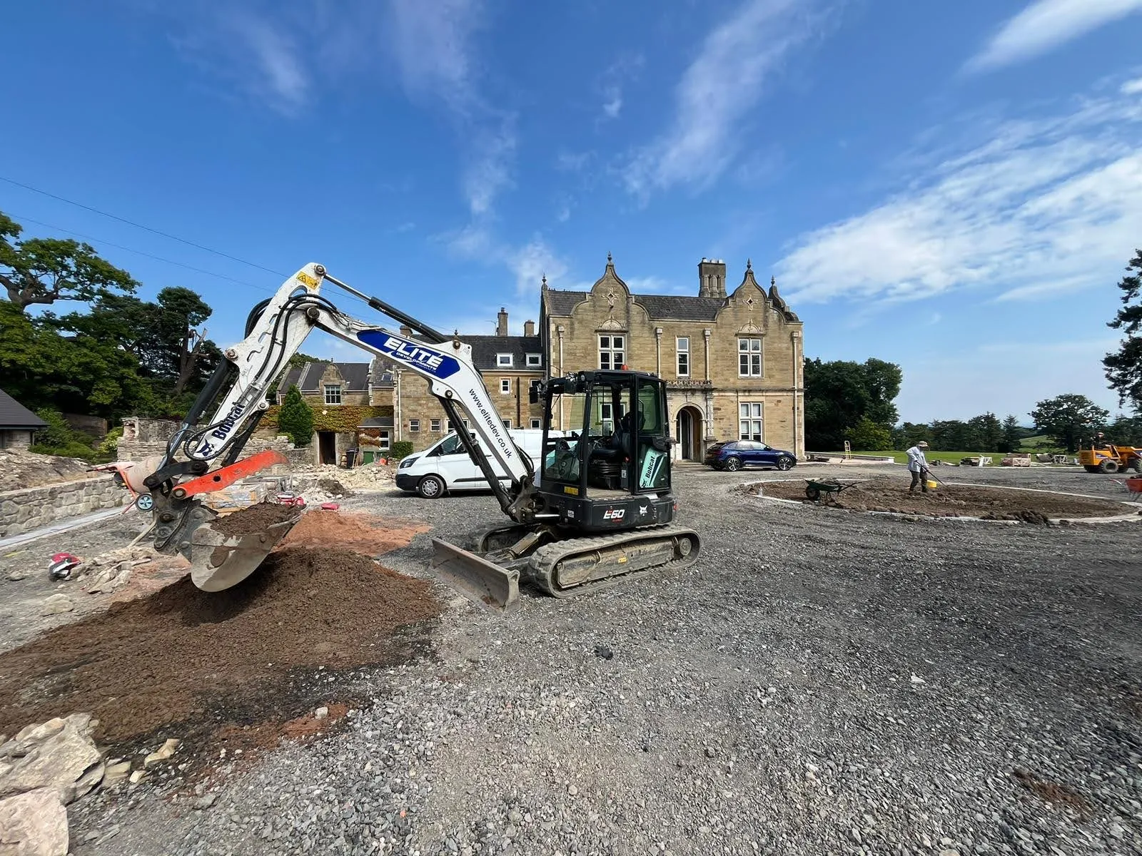 Elite Developments excavator working the forecourt of a sandstone manor house near Oswestry